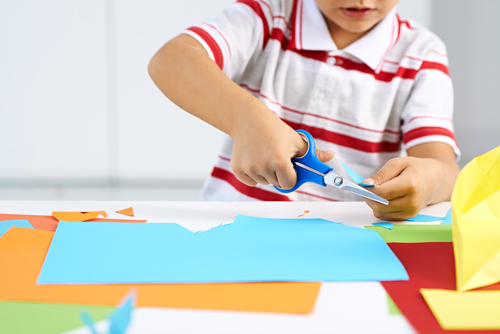 boy cutting paper